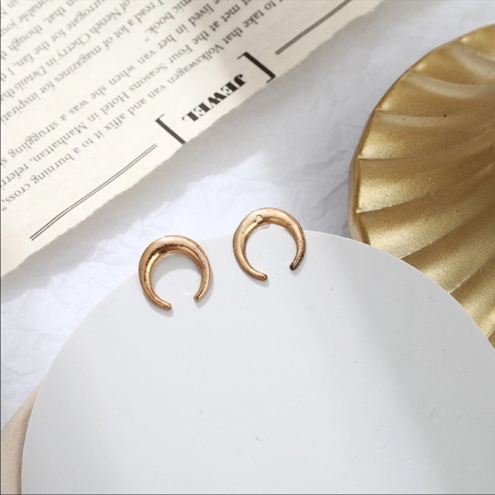 Gold tone crescent earrings